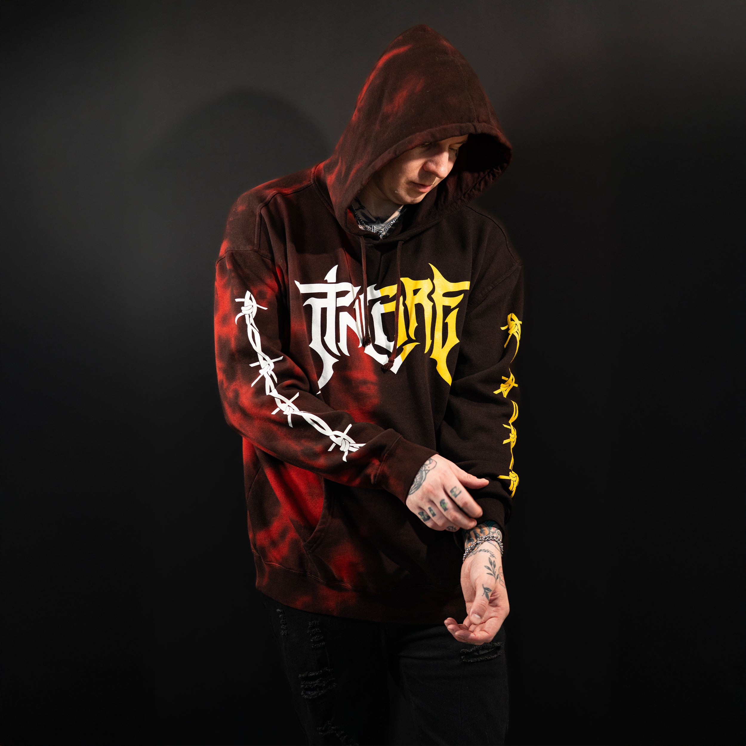 Pincore Merchandise limited edition tie dye hoodie black and red with bold graffiti logo and barbed wire sleeve prints